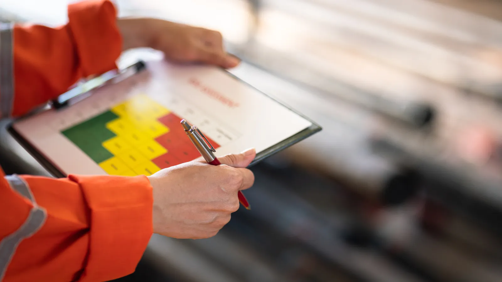 Fire risk assessment being carried out with a colour-coded risk chart