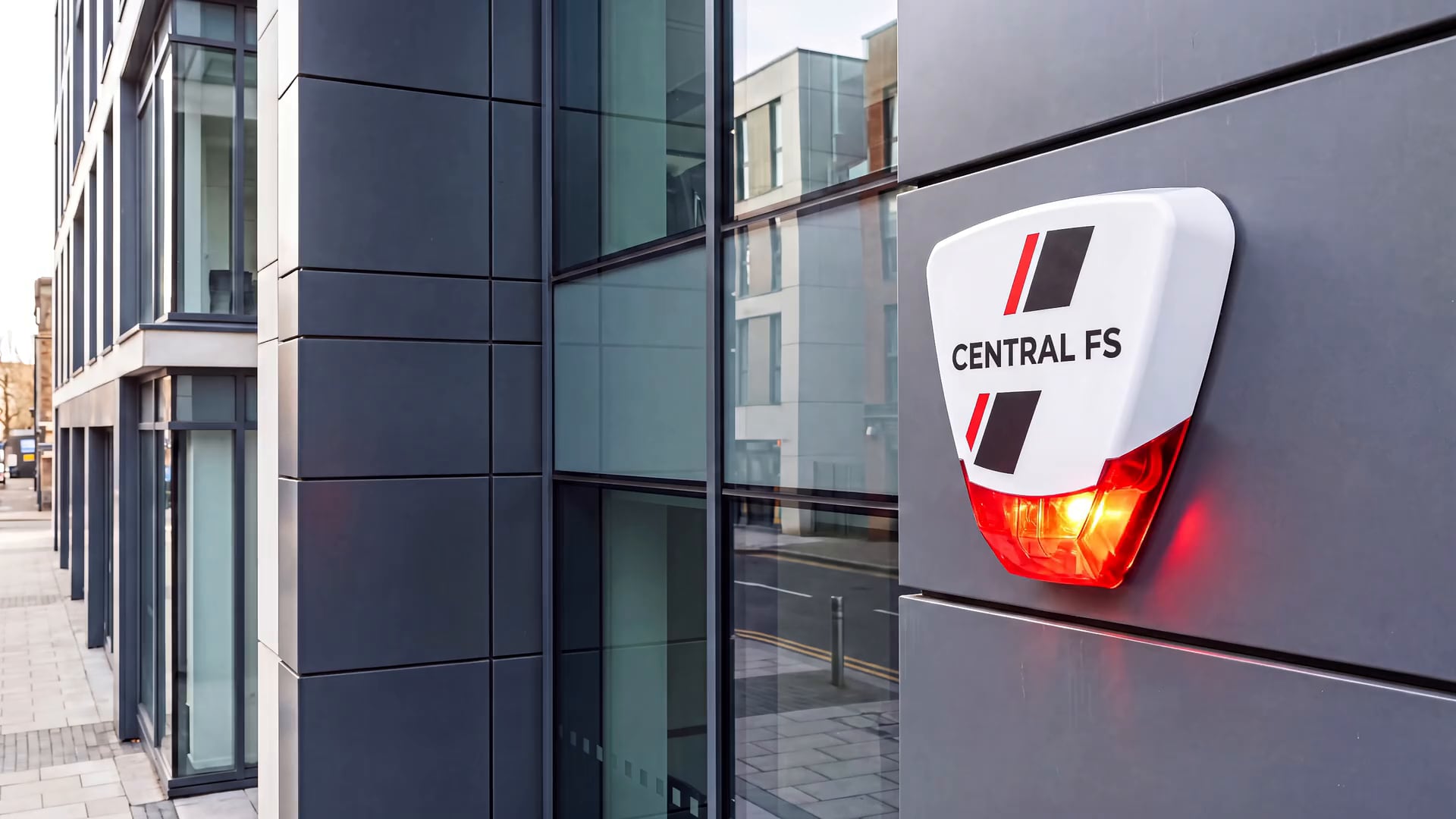 CFS Central Fire & Security branded alarm sounder installed on a modern office building